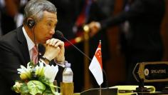 Singapore's Prime Minister Lee Hsien Loong listens to the speech during the plenary session of the 25th ASEAN summit at Myanmar International Convention Centre in Naypyitaw November 12, 2014. REUTERS/Damir Sagolj 