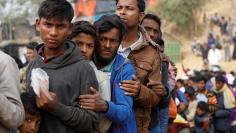 FILE PHOTO: Rohingya refugees line up for daily essentials distribution at Balukhali camp, near Cox's Bazar, Bangladesh January 15, 2018. REUTERS/Tyrone Siu