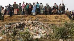 Rohingya refugees line up for daily essentials distribution at Balukhali camp, near Cox's Bazar, Bangladesh January 15, 2018. REUTERS/Tyrone Siu