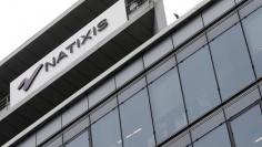 The logo of French bank Natixis is seen outside one of their offices in Paris October 16, 2013. REUTERS/Jacky Naegelen