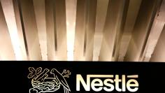 FILE PHOTO: The Nestle logo is pictured on the company headquarters entrance building in Vevey, Switzerland February 18, 2016. REUTERS/Pierre Albouy/File Photo