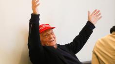 Former motor racing champion Niki Lauda gestures during a meeting with Niki's employees at Vienna airport in Schwechat