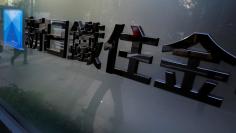 FILE PHOTO: A logo of Nippon Steel & Sumitomo Metal Corp is pictured outside its headquarters in Tokyo