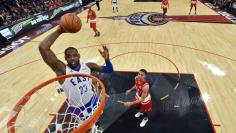 File photo of Eastern Conference forward LeBron James of the Cleveland Cavaliers goes up for a dunk during the NBA  All-Star Game in Toronto