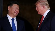 FILE PHOTO: U.S. President Donald Trump welcomes Chinese President Xi Jinping at Mar-a-Lago state in Palm Beach, Florida, U.S.