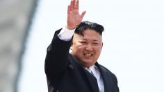 FILE PHOTO: North Korean leader Kim Jong Un waves to people attending a military parade marking the 105th birth anniversary of country's founding father, Kim Il Sung in Pyongyang, April 15, 2017. REUTERS/Damir Sagolj    