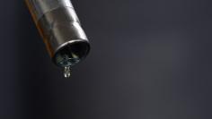 FILE PHOTO - A drop of diesel is seen at the tip of a nozzle after a fuel station customer fills her car's tank in Sint Pieters Leeuw December 5, 2014. REUTERS/Yves Herman   