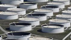 FILE PHOTO: Crude oil storage tanks are seen from above at the Cushing oil hub, appearing to run out of space to contain a historic supply glut that hammered prices, in Cushing, Oklahoma, March 24, 2016. REUTERS/Nick Oxford/File Photo 