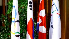 Flags of the International Olympic Committee (IOC), the Republic of Korea (ROK), the Democratic People’s Republic of Korea (DPRK), and the PyeongChang 2018 Organising Committee (POCOG) are seen at the IOC headquarters in Lausanne, Switzerland, January 