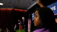 FILE PHOTO: Garner raises her hand to ask U.S. Democratic presidential candidate Sanders a question in Columbia