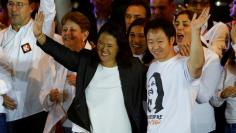 FILE PHOTO: Peruvian presidential candidate Keiko Fujimori and her brother and congressman Kenji attend a closing campaign rally in Lima