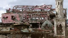 Damaged houses, buildings and a mosque are seen inside Marawi city, Philippines, October 25. 



REUTERS/Romeo Ranoco