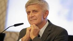 Marek Belka, Poland's central bank governor, smiles as he listens to a question during a news conference at the bank's headquarters in Warsaw October 8, 2014. REUTERS/Slawomir Kaminski/Agencja Gazeta 
