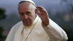 Pope Francis waves as he arrives at the Cathedral of Kampala in Kampala, Uganda, November 28, 2015. REUTERS/Stefano Rellandini