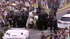 Pope Francis comes to aid of a police officer who was thrown off his horse during the papal parade in Iquique