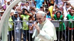 Pope Francis waves as he arrives at the Basadre Institute in Puerto Maldonado