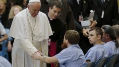 Pope Francis shakes hands with an inmate as he meets with prisoners at Curran-Fromhold Correctional Facility in Philadelphia, September 27, 2015.     REUTERS/Jonathan Ernst 