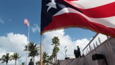 Puerto Rico's new governor Ricardo Rossello (R) addresses the audience during his swear-in ceremony outside the Capitol in San Juan, Puerto Rico January 2, 2017. REUTERS/Alvin Baez 