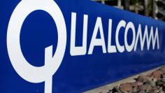 FILE PHOTO: A sign on the Qualcomm campus is seen, as chip maker Broadcom Ltd announced an unsolicited bid to buy peer Qualcomm Inc for $103 billion, in San Diego, California, U.S. November 6, 2017. REUTERS/Mike Blake/File Photo