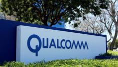 FILE PHOTO: A Qualcomm sign is pictured at one of its many campus buildings in San Diego, California, U.S. April 18, 2017.  REUTERS/Mike Blake/File Photo 