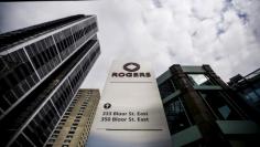 FILE PHOTO: A sign stands in front of the Rogers Communications Inc. building on the day of their annual general meeting for shareholders in Toronto, April 21, 2015.    REUTERS/Mark Blinch/File Photo     