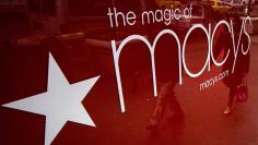 People are reflected in a window outside the Macy's department store in New York in this November 22, 2013 REUTERS/Brendan McDermid 