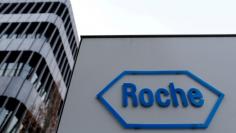 FILE PHOTO: The logo of Swiss pharmaceutical company Roche is seen outside their headquarters in Basel, Switzerland.