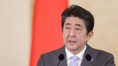 Japan's Prime Minister Shinzo Abe delivers a speech during a joint news conference alongside Romania's President Klaus Werner Iohannis in Bucharest