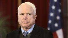 U.S. Senator John McCain listens during a news conference in Riga in this April 15, 2014 file photo. REUTERS/Ints Kalnins/Files 