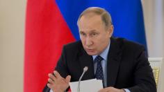Russian President Vladimir Putin chairs a meeting with members of the State Council to discuss progress of presidential decrees, which came into effect in May 2012 on his inauguration day, at the Kremlin in Moscow, Russia, May 4, 2017. REUTERS/Ivan Sekre