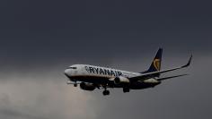 FILE PHOTO: A Ryanair plane prepares to land at Manchester Airport in Manchester northern England, March 31, 2016. REUTERS/Phil Noble/File Photo