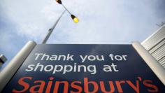 FILE PHOTO: A sign is displayed at a Sainsbury's store in London