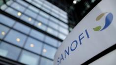 FILE PHOTO - A logo is seen in front of the entrance at the headquarters French drugmaker Sanofi in Paris October 30, 2014. REUTERS/Christian Hartmann/File Photo                 