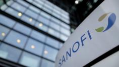 FILE PHOTO: A logo is seen in front of the entrance at the headquarters French drugmaker Sanofi in Paris October 30, 2014. REUTERS/Christian Hartmann/File Photo 