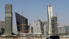 FILE PHOTO: A vehicle drives past the King Abdullah Financial District in Riyadh, Saudi Arabia, October 18, 2017. REUTERS/Faisal Al Nasser/File Photo