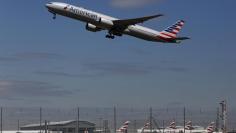 An American Airlines airplane takes off from Heathrow airport in London