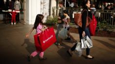 People shop at The Grove mall in Los Angeles November 26, 2013. REUTERS/Lucy Nicholson