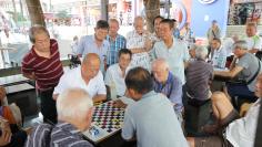 Men play checkers in Singapore