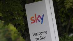 FILE PHOTO: The Sky logo is seen outside of an entrance to offices and studios in west London, Britain June 29, 2017. REUTERS/Toby Melville/File Photo