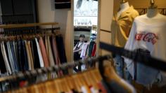 A woman walks in Myeongdong shopping district in Seoul