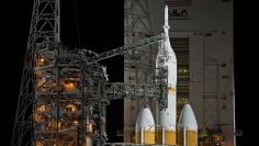 The Mobile Service Tower rolls back from the Delta IV Heavy with the Orion spacecraft on launch pad 37B at Cape Canaveral Air Force Station in Cape Canaveral, Florida, December 4, 2014.  REUTERS/Steve Nesius