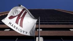 A Marriott flag hangs at the entrance of the New York Marriott Downtown hotel in Manhattan, New York November 16, 2015.  REUTERS/Andrew Kelly