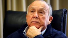 FILE PHOTO: South African magnate Christo Wiese, Steinhoff's largest shareholder and chairman, listens during an interview in Cape Town, South Africa, September 27, 2016. Picture taken September 27, 2016. REUTERS/Mike Hutchings/File Photo