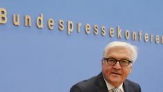 German Foreign Minister Frank-Walter Steinmeier arrives for a news conference with his French counterpart Minister Laurent Fabius (not pictured) in Berlin October 15, 2014. REUTERS/Fabrizio Bensch 