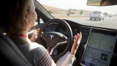 New Autopilot features are demonstrated in a Tesla Model S during a Tesla event in Palo Alto, California October 14, 2015. REUTERS/Beck Diefenbach   