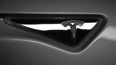 The logo is seen on a new all-wheel-drive version of the Tesla Model S car in Hawthorne, California October 9, 2014.  REUTERS/Lucy Nicholson 