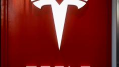 The Tesla logo is seen at the entrance to Tesla Motors' new showroom in Manhattan's Meatpacking District in New York City