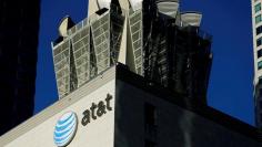 FILE PHOTO:    An AT&T logo and communication equipment is shown on a building in downtown Los Angeles, California October 29, 2014.    REUTERS/Mike Blake/File Photo