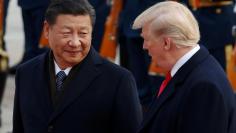 FILE PHOTO: U.S. President Donald Trump takes part in a welcoming ceremony with China's President Xi Jinping at the Great Hall of the People in Beijing, China, November 9, 2017. REUTERS/Damir Sagolj