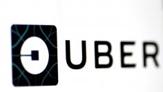 FILE PHOTO - The Uber logo is seen on a screen in Singapore